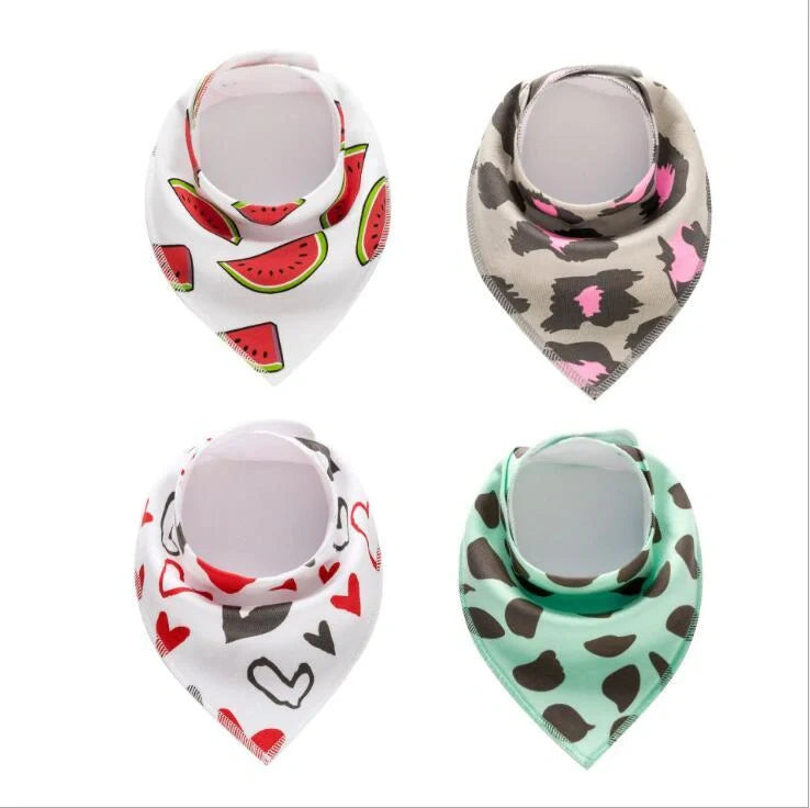 Set of four cotton baby bibs with arrow and wave designs for mess-free feeding
