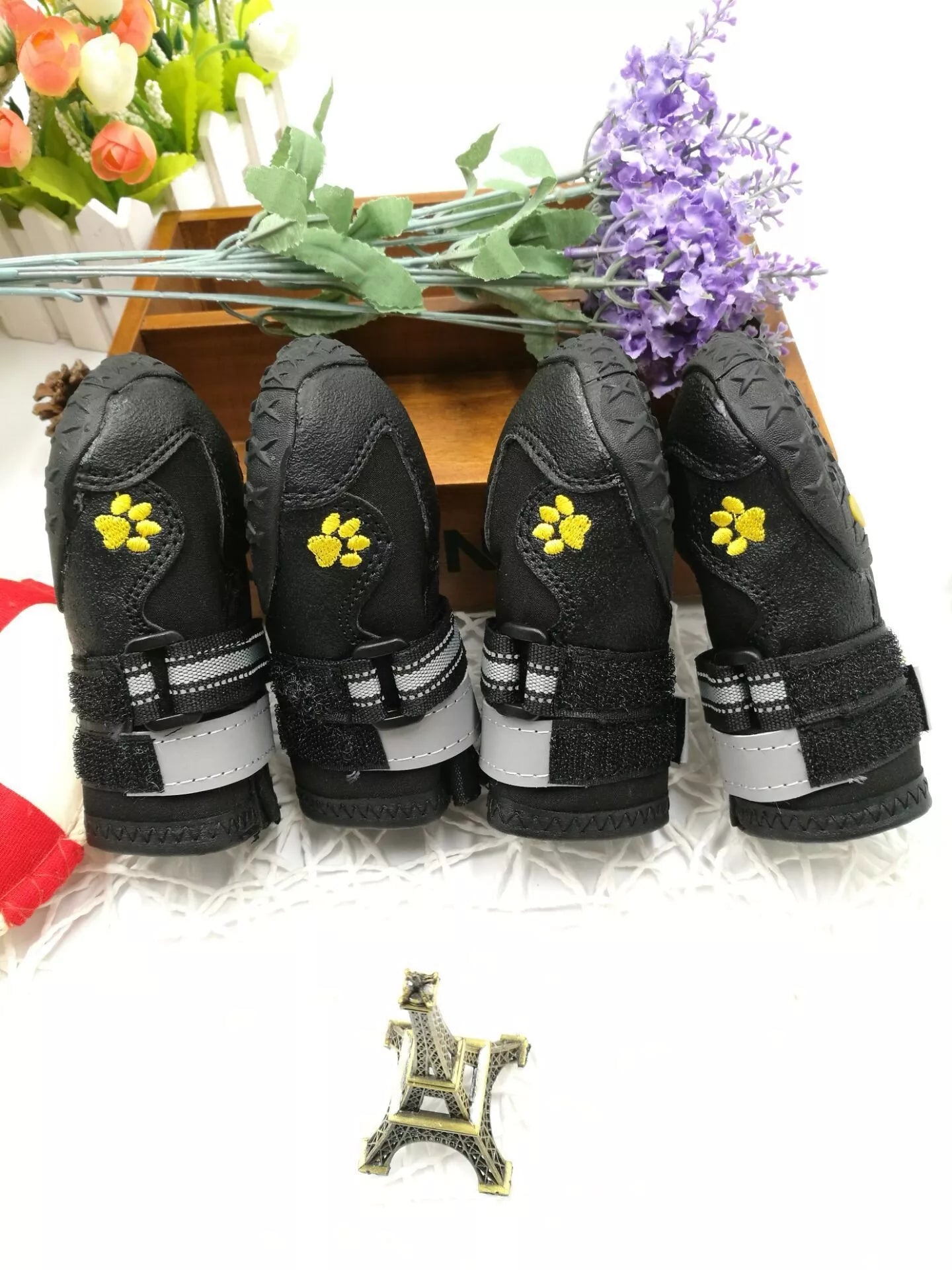 Black waterproof dog shoes with non-slip soles and adjustable fuzzy belt