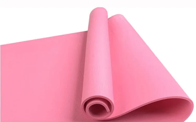 EVA composite fitness and yoga mat in blue, showing its texture and rolled edge next to a storage bag.