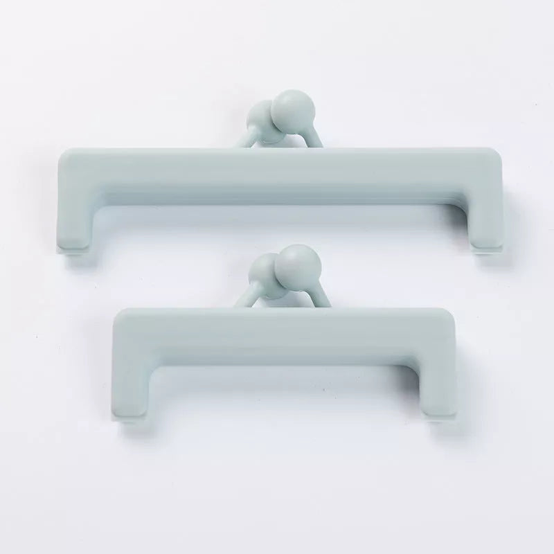 Push-button plain food bag sealing clip in blue and pink, sizes large and small