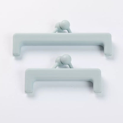 Push-button plain food bag sealing clip in blue and pink, sizes large and small