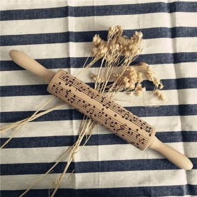 Festive rolling pin with embossed Christmas designs for easy imprinting on dough