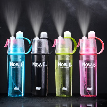Green mist spray water bottle with clear volume scale and leakproof lid on a wooden table.