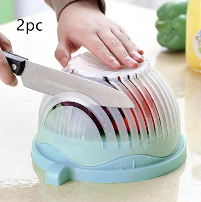 Blue salad cutter bowl showing cutting lid with seams, drain basket function, and reversible base plate