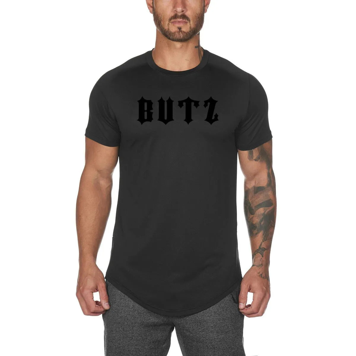 Men's plain grey gym shirt, blouse style, on a hanger showing relaxed fit and cotton-spandex fabric.