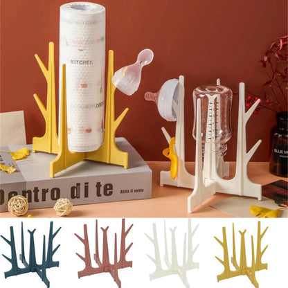 Creative Tree Branch Bottle Drying Rack for baby feeding bottles and accessories in blue, yellow, white, and nude