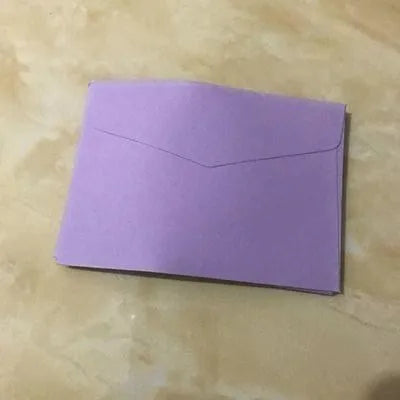 Mini coloured paper envelopes in various hues measuring 11.5 by 8 centimetres