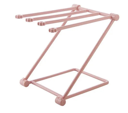 Foldable plastic dishcloth shelf organiser in light blue mounted on a wall.