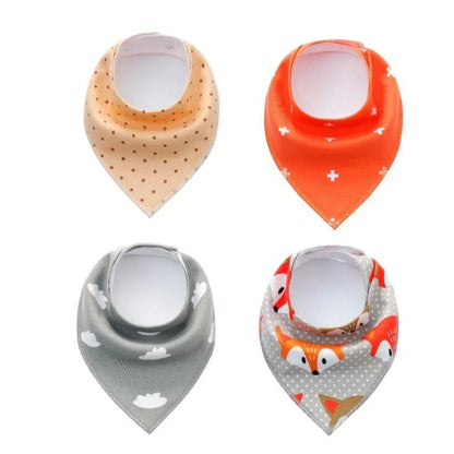 Set of four cotton baby bibs with arrow and wave designs for mess-free feeding
