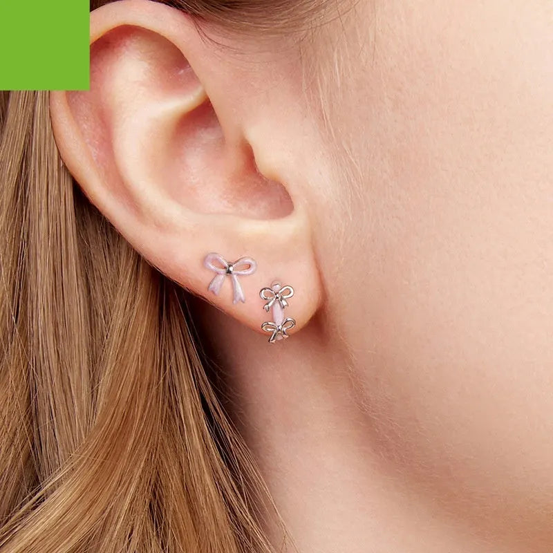 S925 sterling silver bow ear clip earrings for women in SCE1926 colour with dripping oil finish, supplied as a pair