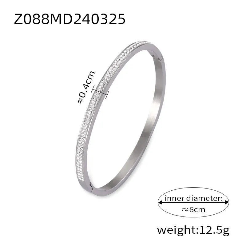 Titanium steel Roman numeral bracelet with gold plated carved design and diamond-embedded detail