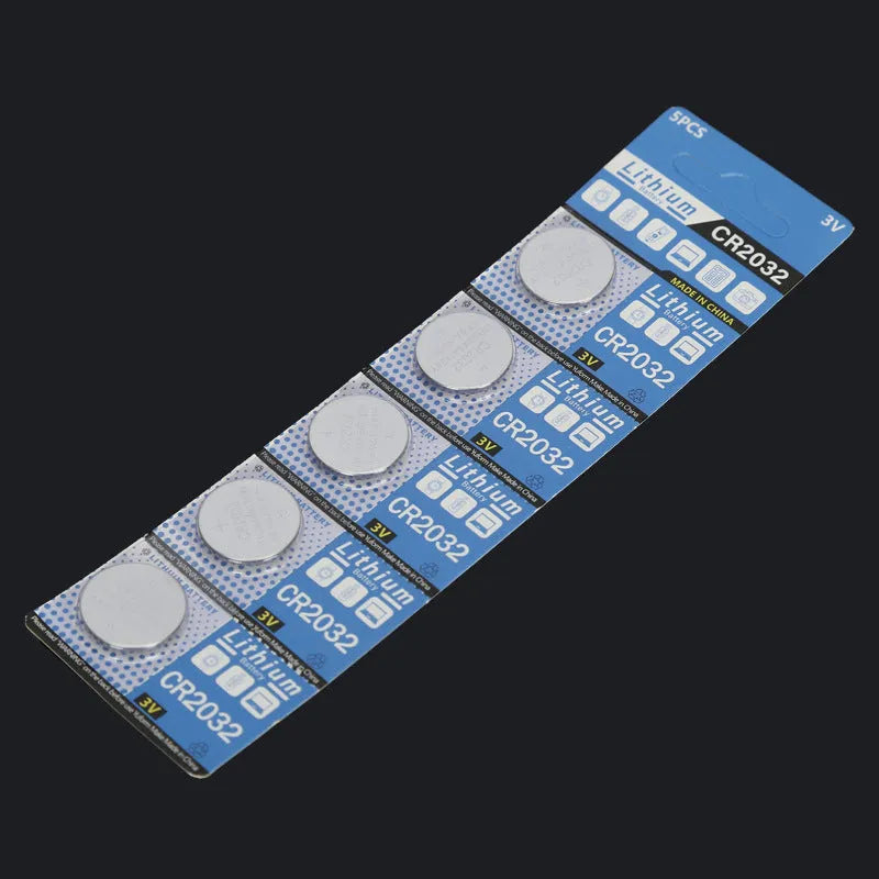Card of five CR2032 3V lithium button batteries for electronics and remote controls.