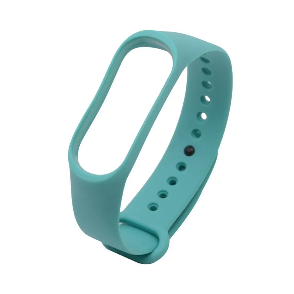 Colourful silicone replacement strap for XIAOMI MI Band 3 smart watch on a wrist.