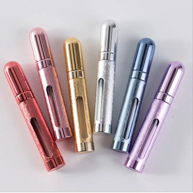 Slim 12ml aluminium travel perfume bottle with glass liner in bullet shape, shown in various colours.