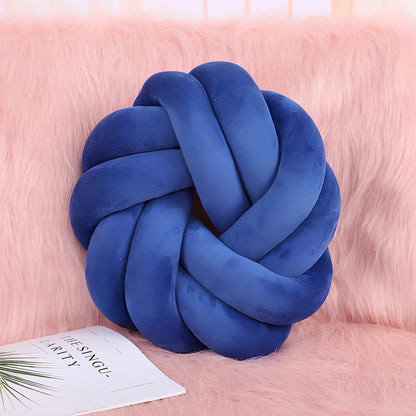 Knotted lumbar pillow with memory foam fill showing adjustable height feature and polyester cover