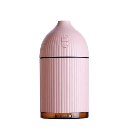 White ultrasonic aromatherapy diffuser and air humidifier with LED light, 300ml capacity, on a desk.