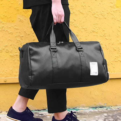 Black waterproof sports bag with separate shoe compartments on the sides, shown with adjustable diagonal strap.