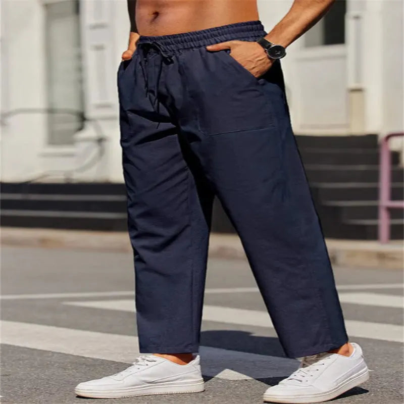 Men's straight-leg linen trousers with an elastic waist in a solid colour
