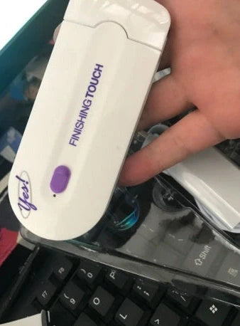 White laser hair removal machine with detachable heads showing 12cm length and included accessories