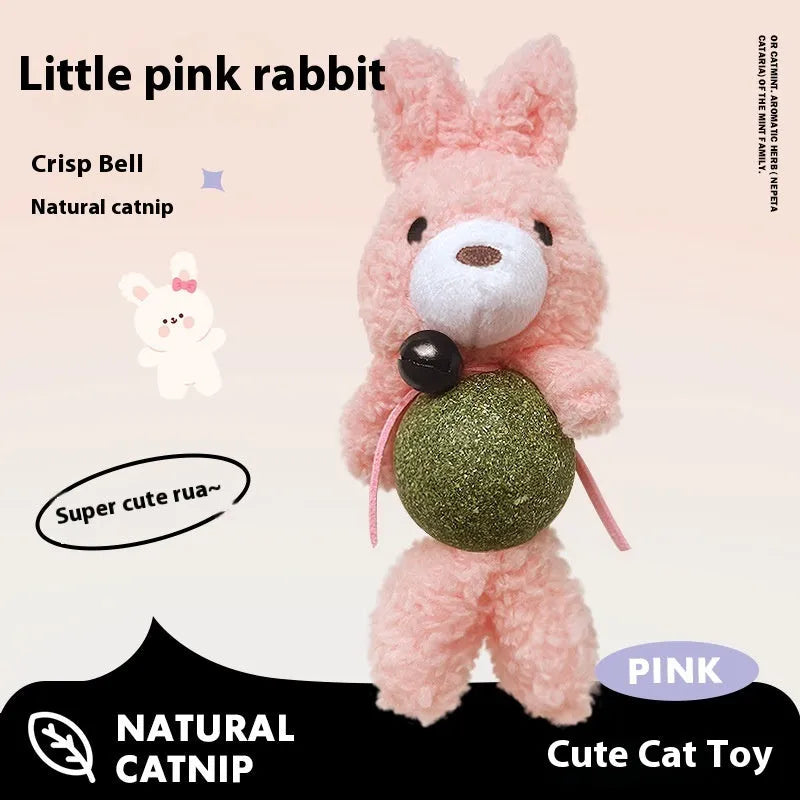Brown bear plush cat toy with a small bell, showing soft texture and size next to a cat for scale.