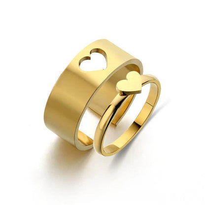 Elegant titanium steel rings in various designs including hearts, butterflies, and crosses, for a timeless and versatile accessory