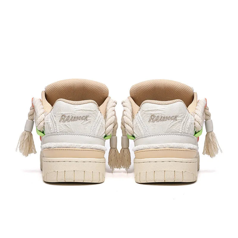 Creamy white old damage lace-up retro skateboard shoes with platform heel on a rubber sole.