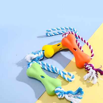 Green porous bone dog toy with knotted rope, hollow for treats, measuring 138mm