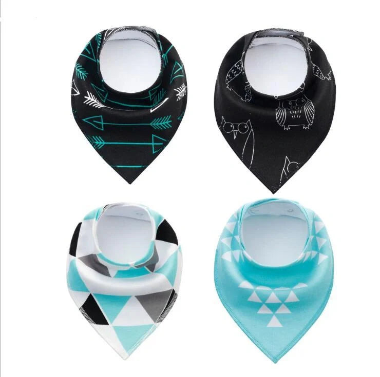 Set of four cotton baby bibs with arrow and wave designs for mess-free feeding