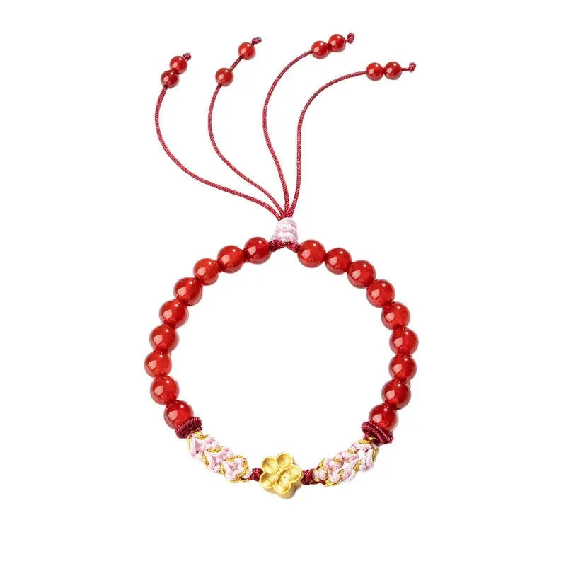 Hand-woven red rope bracelet with crystal peach blossom charm in Chinese style