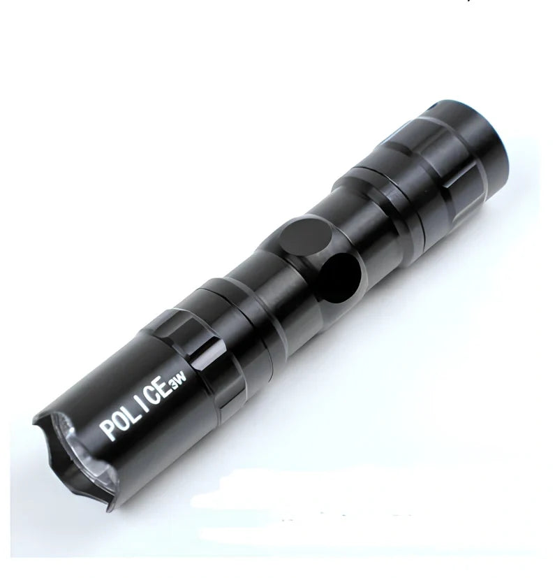 Black aluminium LED mini flashlight measuring 9.5cm with 3W bulb and AA battery compartment