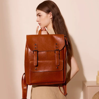 Genuine cowhide leather women's computer backpack in black, shown from a front perspective.