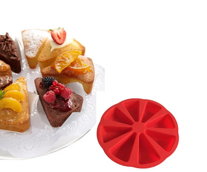 Green silicone cake mould measuring 7 by 4.5 centimetres on a baking tray.