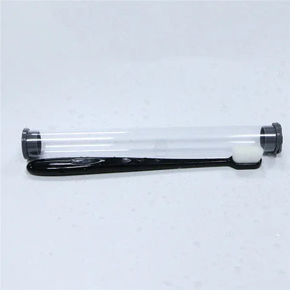 Micron soft toothbrush with coloured handles and different bristle styles including flat head and wavy designs