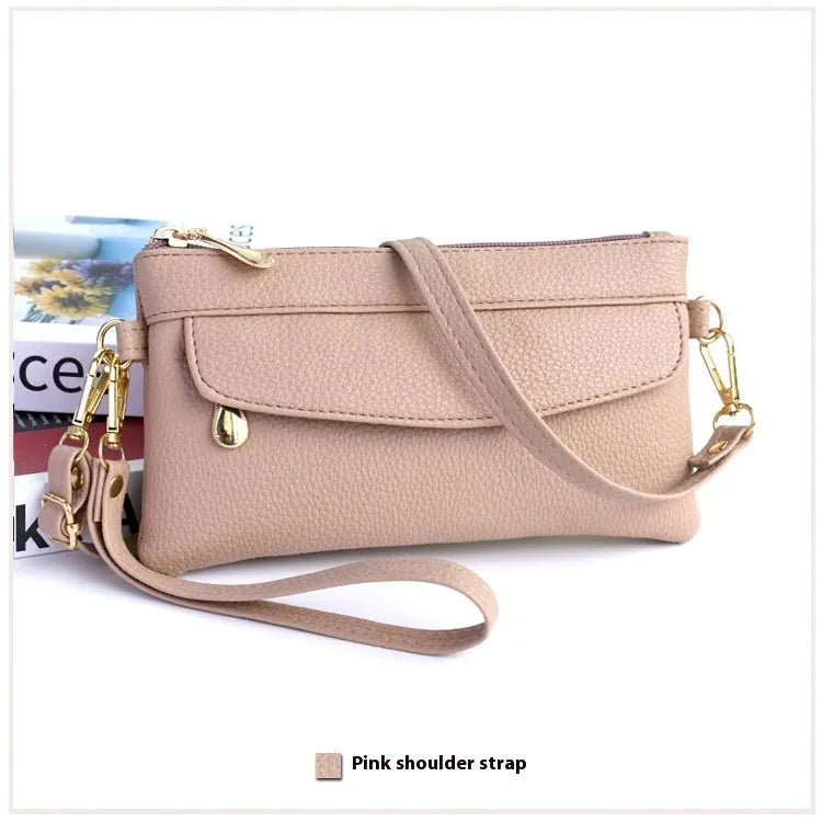 Soft surface square PU crossbody bag and clutch with internal zipper pocket in various colours.