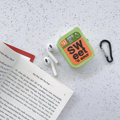Green silicone AirPods case with raised cartoon animal design, showing charging port cutout.