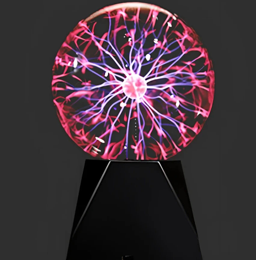 Plasma ball with colourful light arcs responding to finger touch on glass sphere