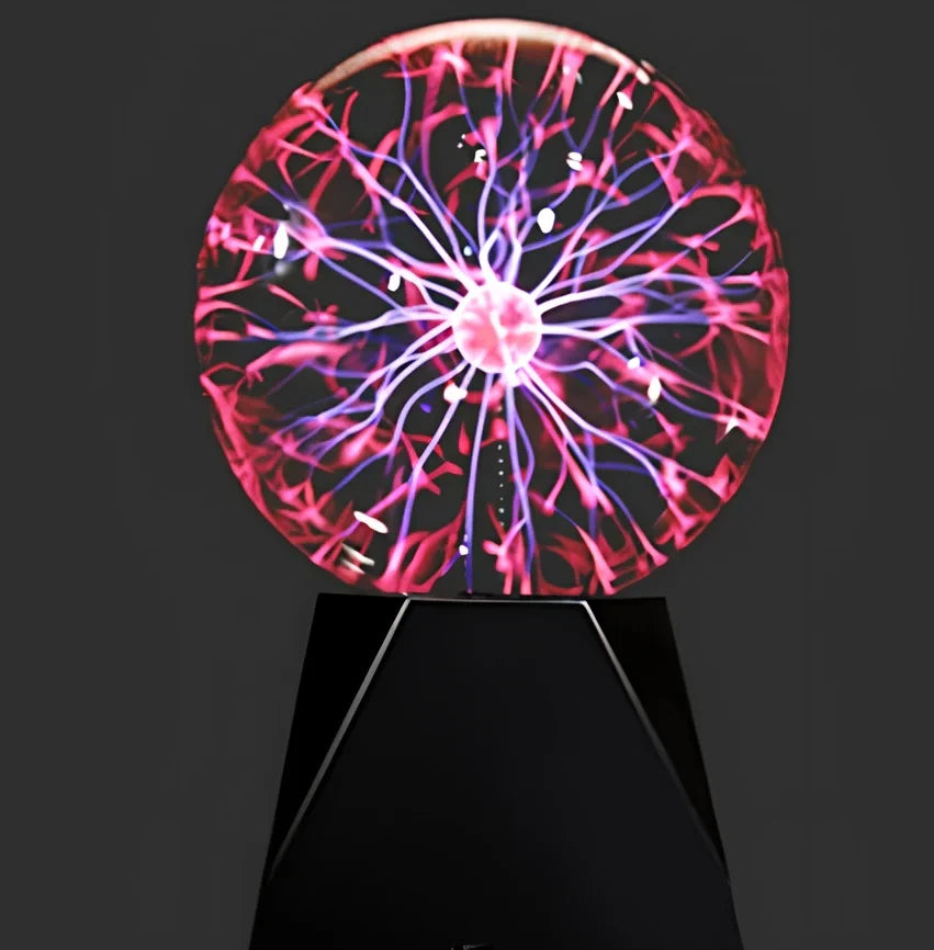 Plasma ball with colourful light arcs responding to finger touch on glass sphere