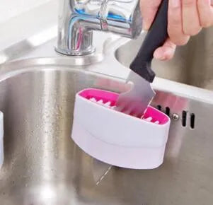 Blue multi-purpose kitchen brush with suction cup for cleaning utensils and vegetables
