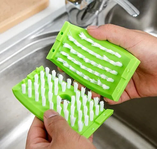 Blue multi-purpose kitchen brush with suction cup for cleaning utensils and vegetables