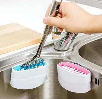 Blue multi-purpose kitchen brush with suction cup for cleaning utensils and vegetables