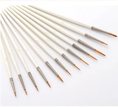 Set of 12 pearl white nylon wool hook line art brushes in a solid wood pen holder.