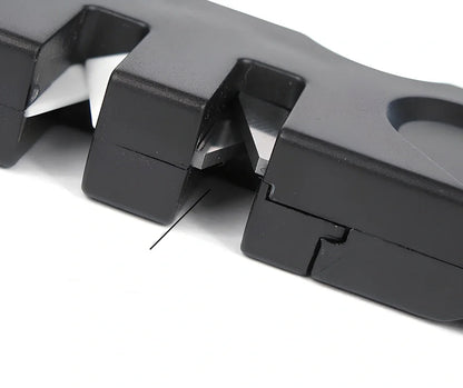 Black Pocket Pal knife sharpener with carbide blades, ceramic slot, and diamond rod, 3-1/2 inches long for hiking use