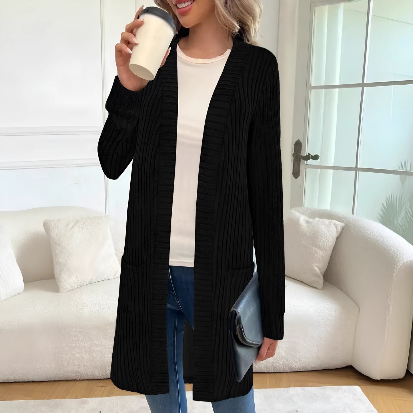 Long sleeve loose fit knitted cardigan jacket with side pockets, shown in grey.