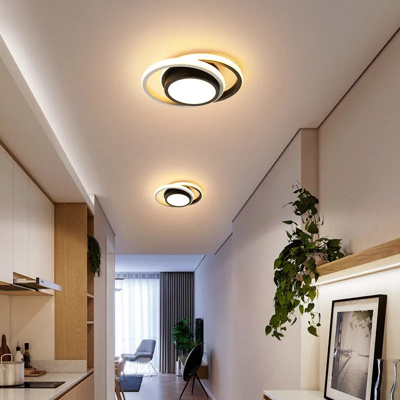 Modern geometric aluminium ceiling light in round and square styles with LED illumination.