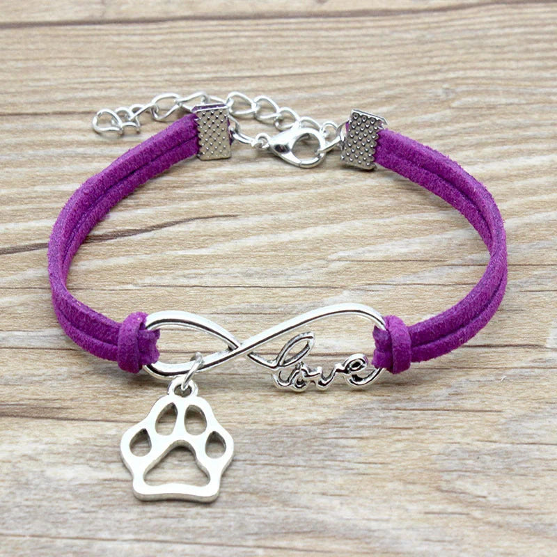 Stylish hand-woven infinite love pet bracelet in various colours, featuring a bow design and made of premium alloy materials