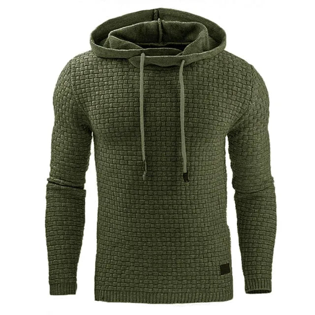 A man wearing a cotton-polyester blend hoodie available in nine colours including black, navy, and red.