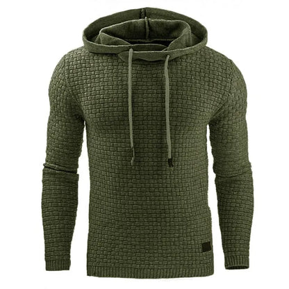 A man wearing a cotton-polyester blend hoodie available in nine colours including black, navy, and red.