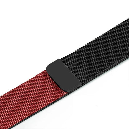 Stainless steel Apple Watch strap in silver on a wrist, showing the metal links and secure clasp.