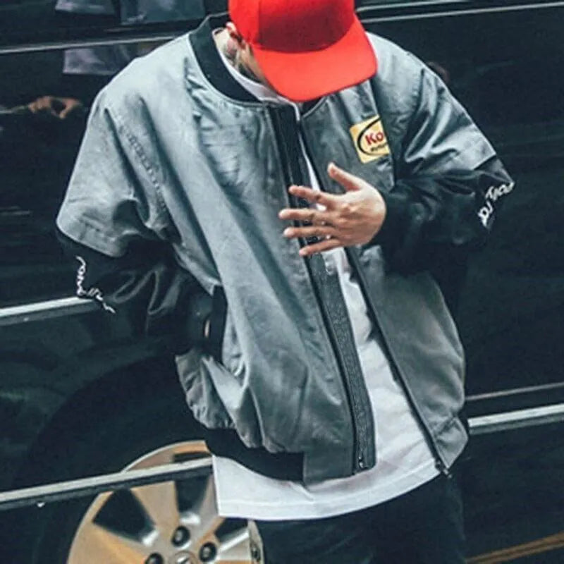 Hip hop style baseball jacket in grey or white with streetwear print, round neck, and side slit pockets.