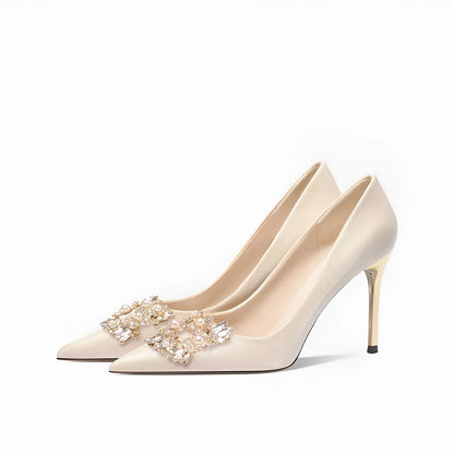 French crystal bridal high heel pump with rhinestones on cloth upper, showing pointed toe and stiletto heel.